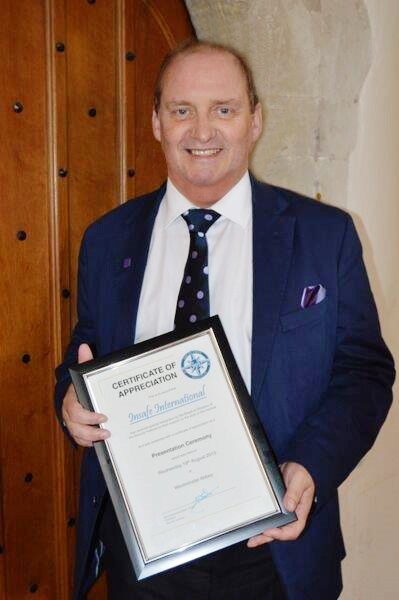 Alan Bullock holding award